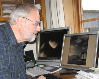 Ole Henningsen studying and researching more than 600 Danish ufo-photos during the last 10 years.
Photo by Ole Henningsen, SUFOI Picture Library